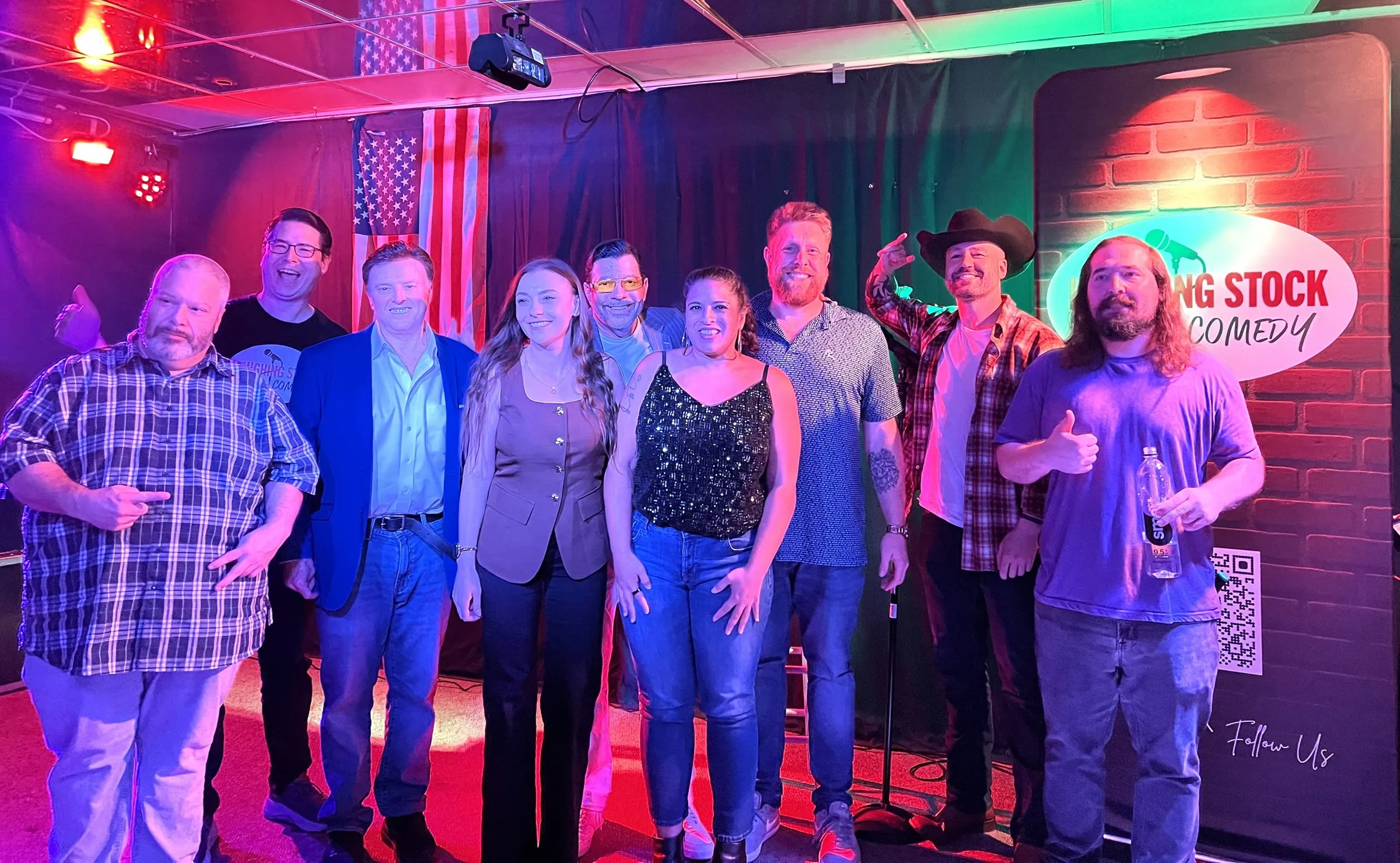 Laughing Stock Comedy comedians posing together on stage at Lake Mary Pub & Tiki Bar